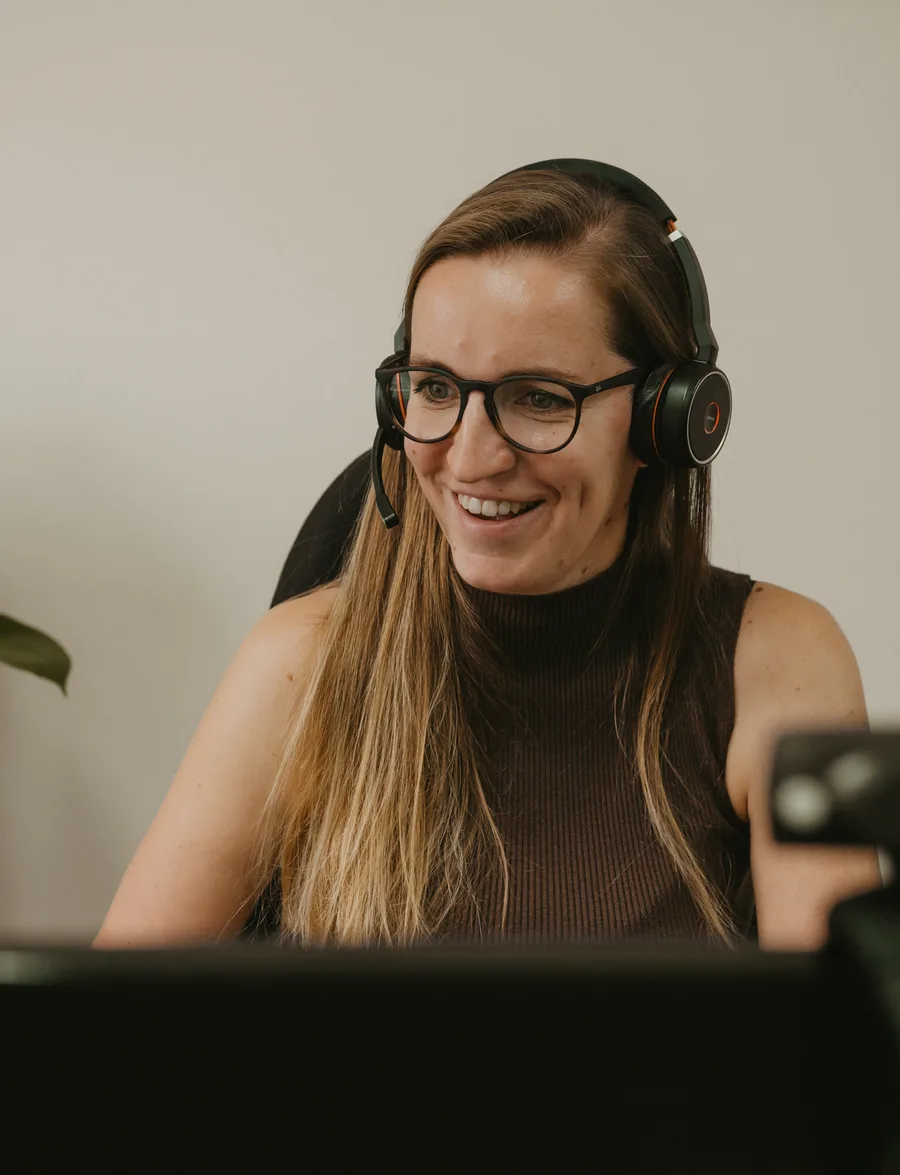 Simone van Kempen at work, wearing a headset